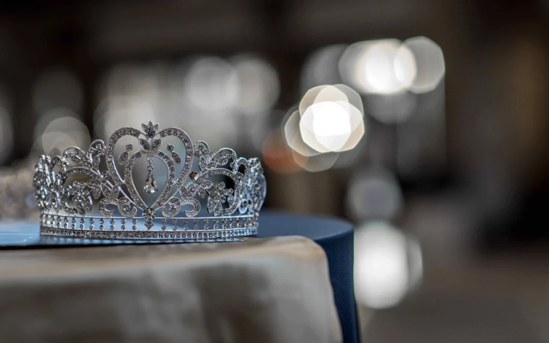 Elegant crown laying on a satin tablecloth