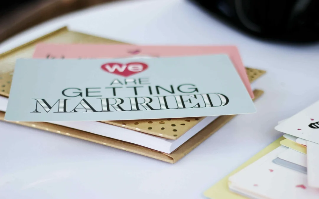 Wedding invitation on top of gold planner