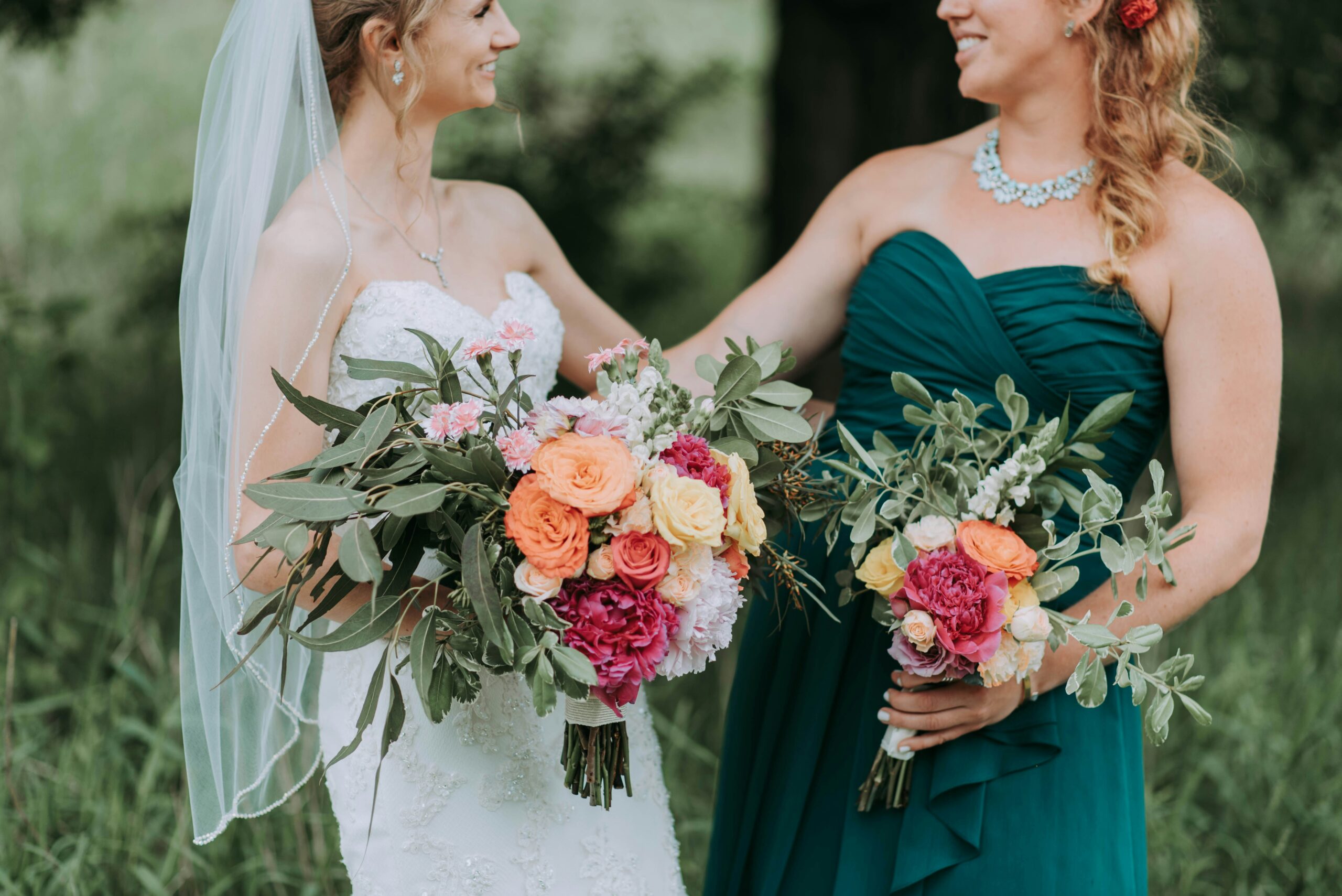 Bride and bridesmaid smiling