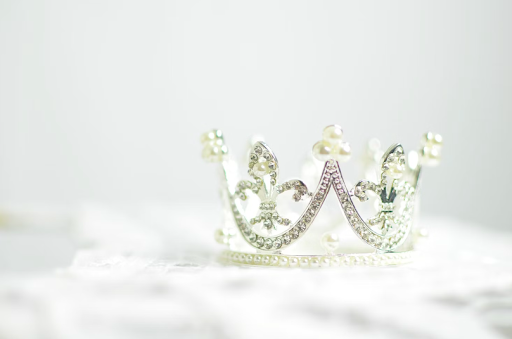 Glittering tiara on white satin